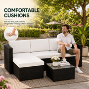 4-seater black rattan corner sofa set with white cushions and glass coffee table for outdoor garden and patio seating