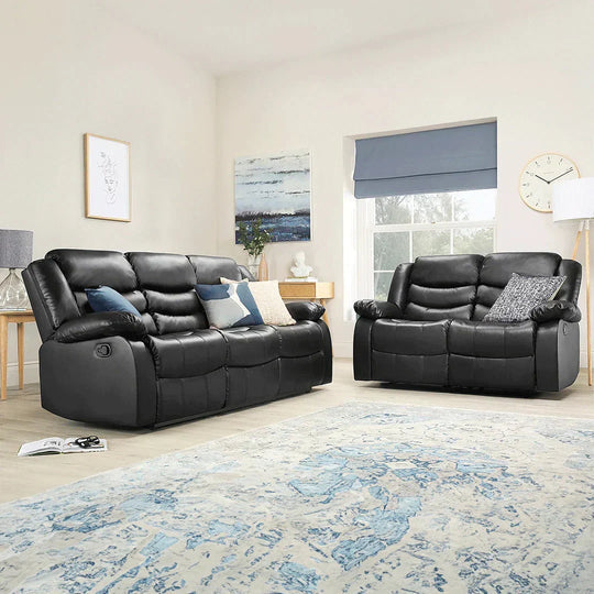 Roma black air leather 3 and 2 seater recliner sofas in a modern living room