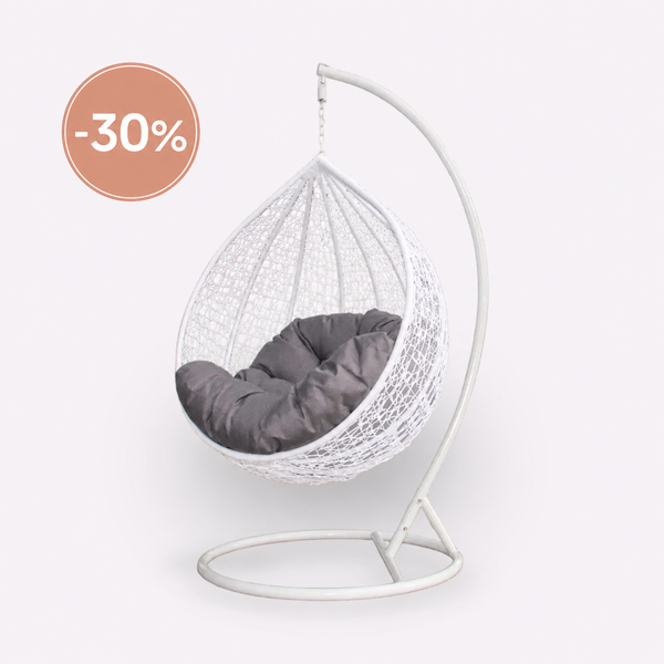 White wicker egg swing chair with grey cushion and freestanding metal frame for indoor and outdoor use